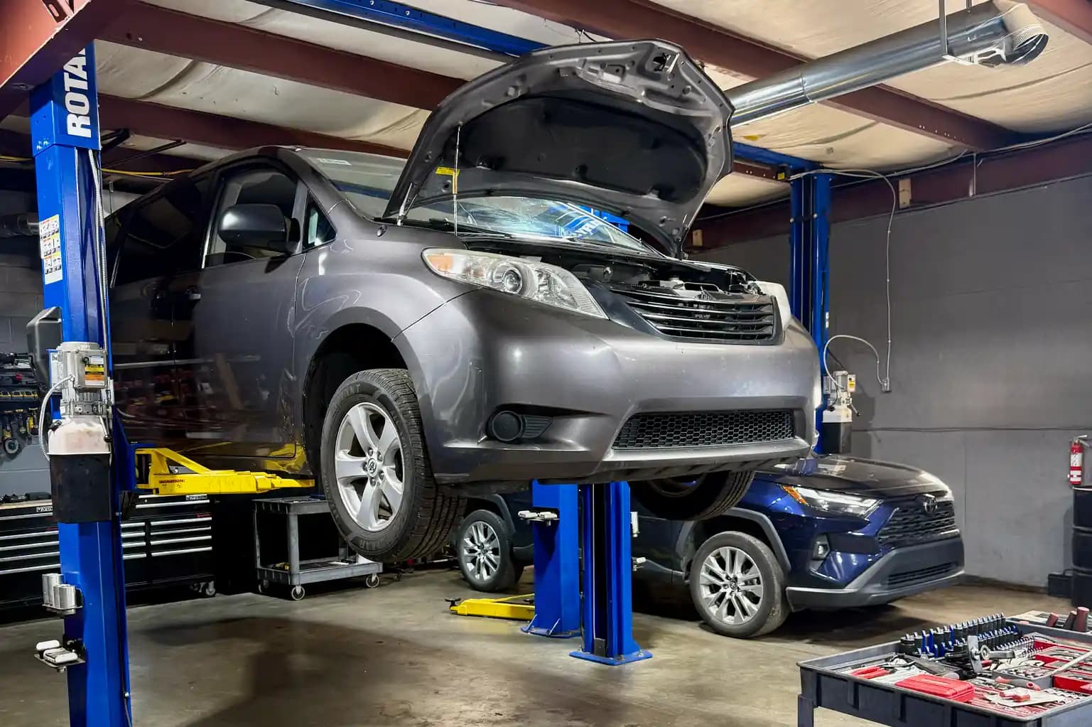 Milan Service Center technician working on a customer vehicle